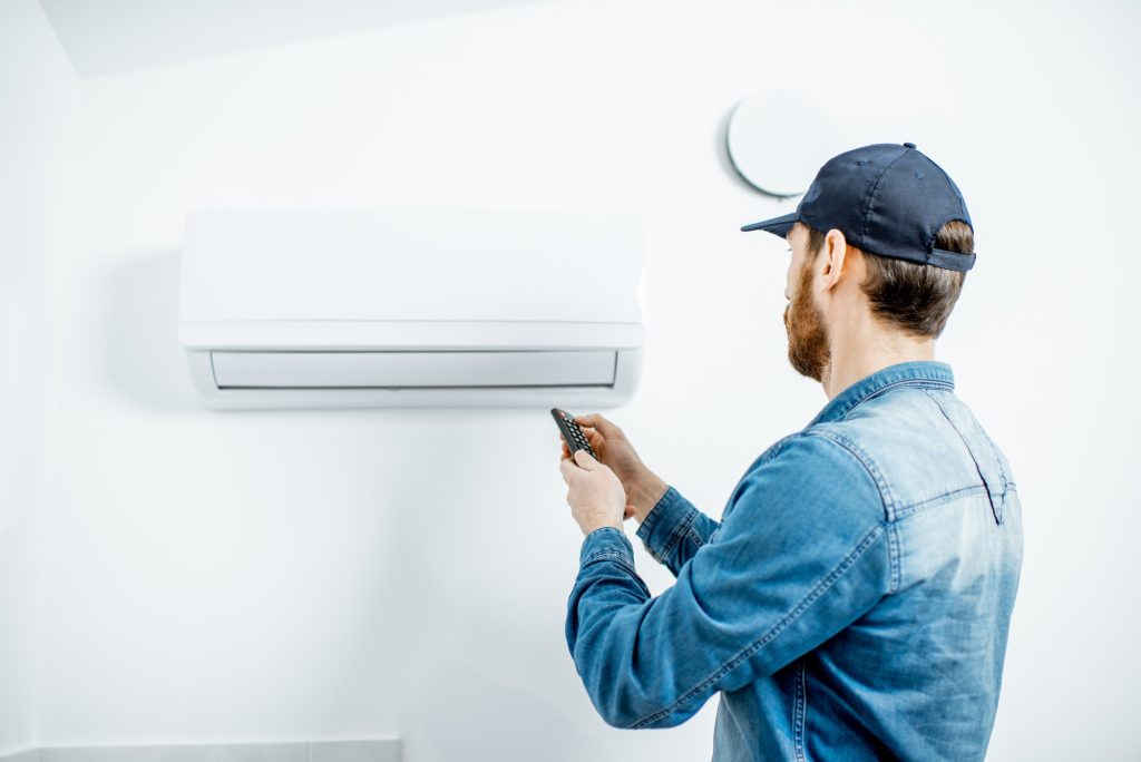 Man serving the air conditioner