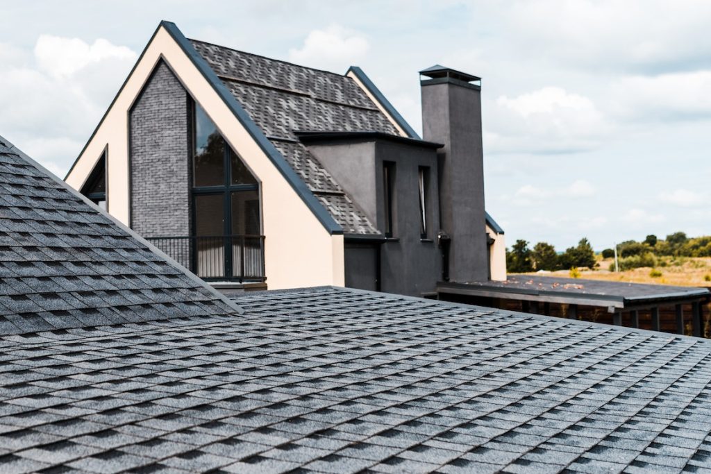 selective focus of building with windows near rooftop